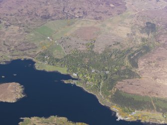 General oblique aerial view of Dunvegan Castle, with the nearby remains of field systems and lazy beds, Isle of Skye, taken from the SW.