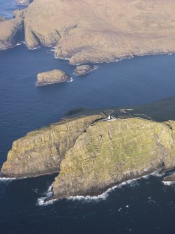 General oblique aerial view of  the remains of  Dun Briste and Sron an Duin, near Barra Head lighthouse overlooking the sea cliffs of Berneray, taken from the S.