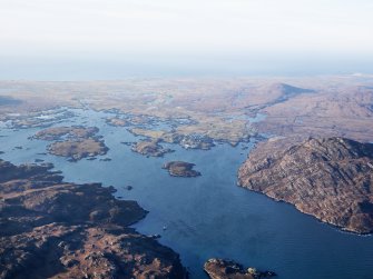General oblique aerial view of Gasaigh, Loch Boisdale and Bein Ruigh Choinich, South Uist, taken from the SE.