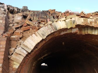 View from south of west chamber arch of the gas-fired Hoffmann Continuous Kiln centred at NS94470 67952. This kiln could hold 380,000 bricks in total.