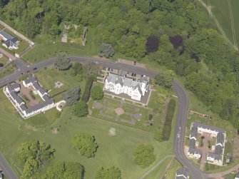 Oblique aerial view of Ballumbie Castle, taken from the SE.