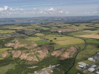 General oblique aerial view of the Winchburgh area centred on Niddry castle, taken from the SW.