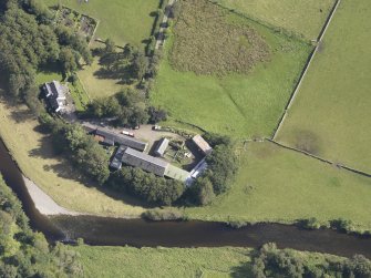 Oblique aerial view of Drumelzier Castle, taken from the WNW.