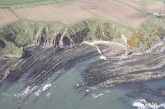 Oblique aerial view of Cove Harbour, Heathery Heugh looking SW.