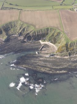 Oblique aerial view of Cove Harbour, Heathery Heugh, looking SW.