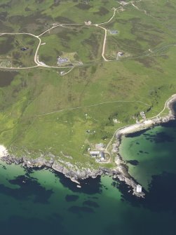 General oblique aerial view of Traigh Bhan and Carraig Fhada Lighthouse, looking NW.