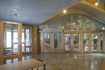 VIew looking across the public entrance foyer of the Scottish Parliament. towards the doors leading into the main hall