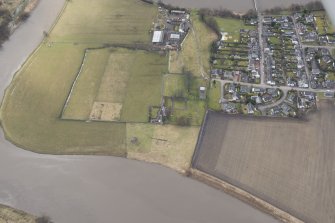 Oblique aerial view centred on the remains of the Abbey of Cambuskenneth, looking to the W.