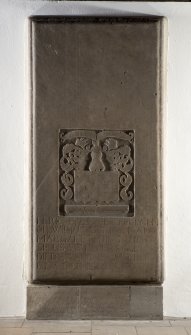 Interior. Church, detail of graveslab mounted against wall of nave