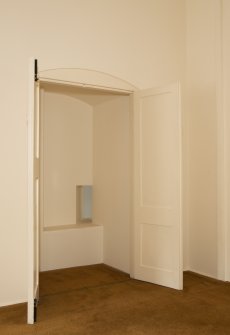 Interior. 1st floor, east range, north room, view of cupboard with squinch