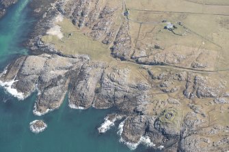 Oblique aerial view of Vaul, Dun Beag, Tiree, looking SE.