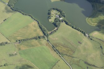 Oblique aerial view of Greenloch House, the site of Soulseat Abbey and the cropmarks of the ring ditch, looking NE.