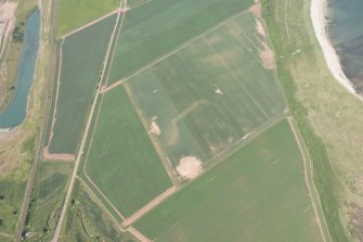 Oblique aerial view of geological cropmarks, looking W.