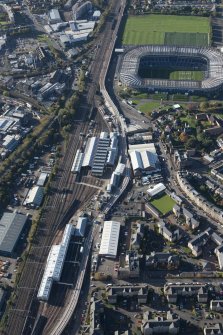 Oblique aerial view of the Edinburgh Tramway, Murrayfield Stadium and Haymarket Motive Power Depot, looking to the W.