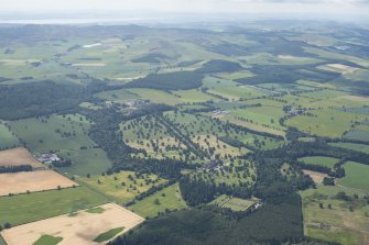 General oblique aerial view centred on Glamis Castle with the Sidlaw Hills in the background, looking SW.