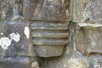 Detail of west corbel (possibly replaced) to middle order of door archway.