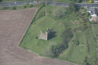 Oblique aerial view of Torthorwald Castle, looking NNW.