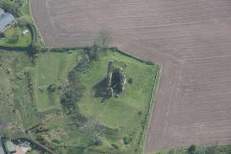 Oblique aerial view of Torthorwald Castle, looking SSE.