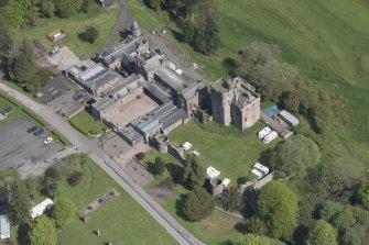 Oblique aerial view of Hoddom Castle, looking NNE.