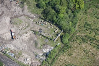 Oblique aerial view of Auchinvole Castle, looking NE.