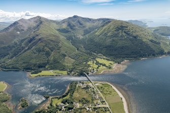 General oblique aerial view of Ballachulish centred on the Ballachulish Bridge, looking SW.
