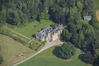 Oblique aerial view of Pitcaple Castle and laundry, looking N.