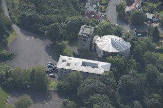 Oblique aerial view of Mearns Castle, looking S.