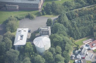 Oblique aerial view of Mearns Castle, looking SE.
