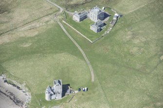 Oblique aerial view of Breachacha House and castle on the Isle of Coll, looking WNW.