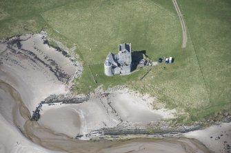 Oblique aerial view of Breachacha Castle on the Isle of Coll, looking WNW.