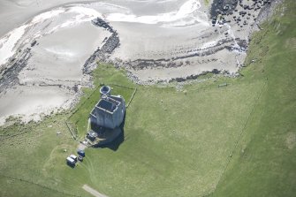 Oblique aerial view of Breachacha Castle on the Isle of Coll, looking S.