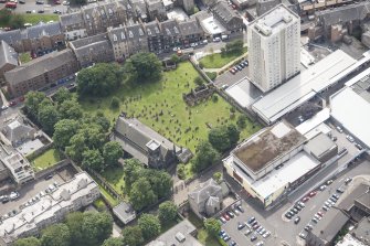 Oblique aerial view of Trinity House and South Leith Parish Church and Churchyard, looking SE.