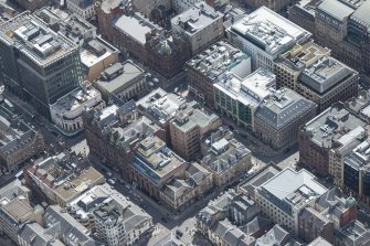 Oblique aerial view of the Lion Chambers and 144 - 146 West George Street, looking ENE.