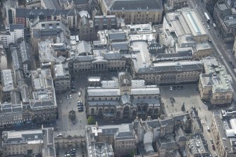 Oblique aerial view of the High Street, Parliament Square and St Giles Cathedral, looking WSW.