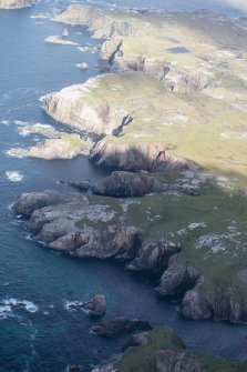 Oblique aerial view of the coast at Mangersta with Stac Dhomhnaill Chaim in the middle distance, looking NNW.