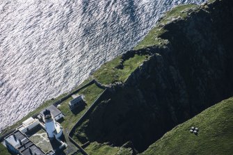 Oblique aerial view of Barra Head Lighthouse and the possible dun, looking SW.