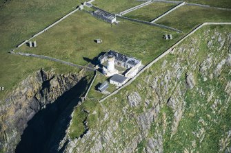 Oblique aerial view of Barra Head Lighthouse and the possible dun, looking NE.