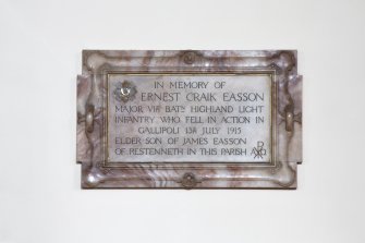 Detail of memorial plaque on south wall.