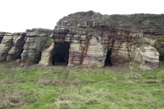 View of entrances to chapel and mortuary caves from south east