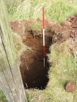 Photograph from watching brief at overhead power line, pole trench, viewed from SE, at Ardoch Roman Fort Braco, Perthshire