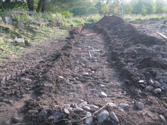 Archaeological evaluation, Trench 2 showing cobbles 036, Allanbank, Duns, Scottish Borders