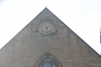 Standing building survey, NE Elevation, Detail of the clock face at the top of the gable, Buccleuch Parish Church, 33 Chapel Street, Edinburgh