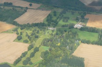 Oblique aerial view of Brahan House and policies, near Contin, Easter Ross, looking NW.