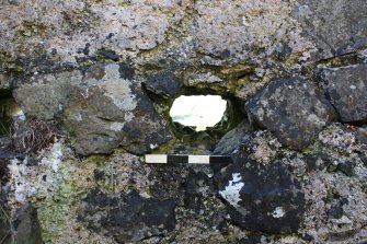 Historic Building Survey photograph, From E, Room C. Detail of floor socket F07 in the W wall, Coroghon Castle, Canna
