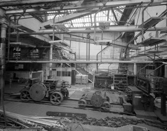 Interior view of East end of ropewalk showing three-part relationship of walk machinery: foregear, traveller and top-cart (reading from right to left).