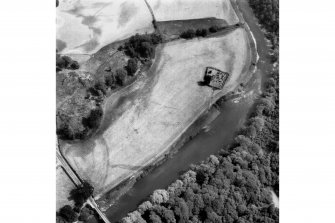 Oblique aerial view centred on burial ground from W.