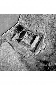 Oblique aerial view centred on castle from SW.