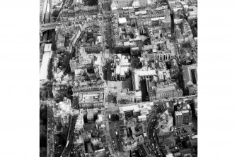 Aerial view of centre of Edinburgh including Market Street on left of photograph, North and South Bridges at top, George IV Bridge to right and Upper Bow at bottom