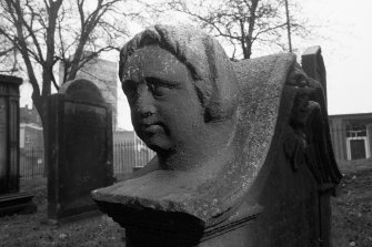 North Leith Burial Ground.
View of gravestone, James Home, face on shoulder of stone.