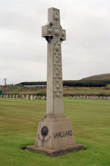 The Memorial to HMS Vanguard, World War I and II Naval Cemetery, Lyness, Hoy, Orkney Islands  This memorial to the officers and men of HMS Vanguard takes the form of a ringed and interlaced Celtic high cross. The inscription on the base reads: Traditions Never Die. HMS Vanguard, a 19,560-ton battleship blew up at anchor off the Calf of Flotta on 9 July 1917 with the loss of over 1,000 men, that is, of all but two of her company.   View from North East